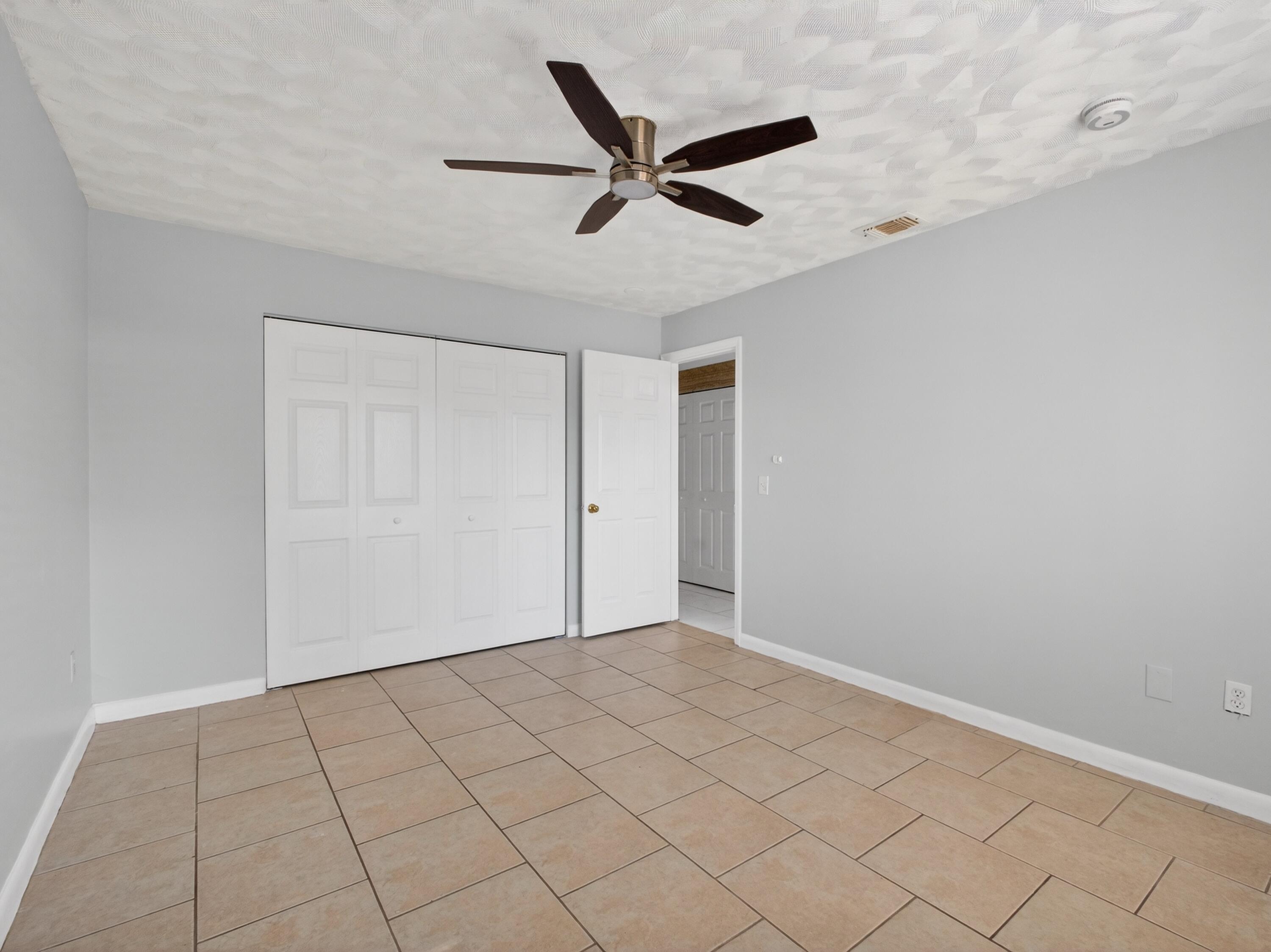 566 Southeast Damask Avenue Port St. Lucie, FL 34983 - Photo 21 of 30 a view of an empty room