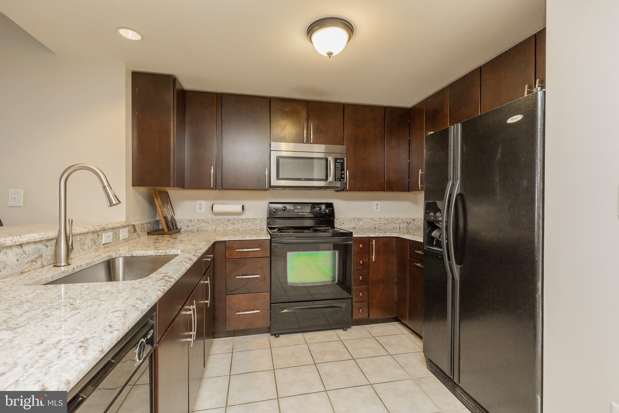 777 7th Street Northwest, Unit 1124 Washington, DC 20001 - Photo 55 of 55 Granite tops - open floor plan kitchen