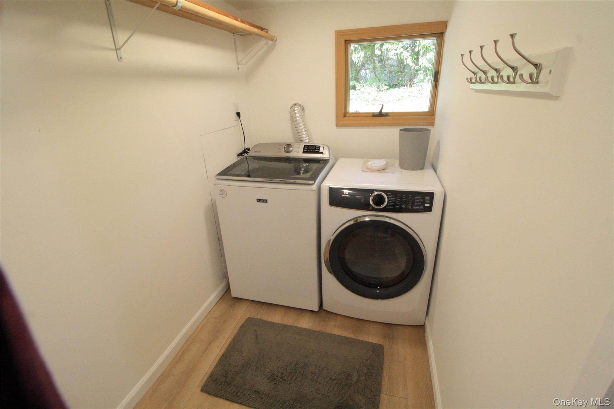 50 Mt Hope Road Carmel, NY 10512 - Photo 7 of 13 Laundry area featuring light wood-style flooring and separate washer and dryer