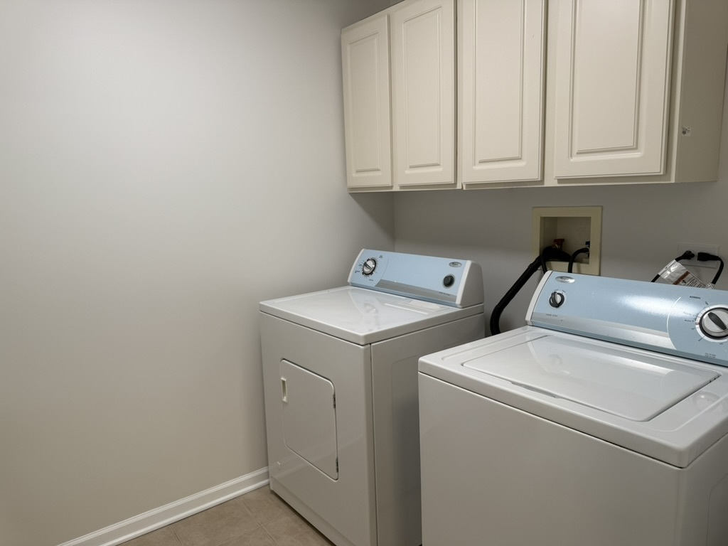 3401 North Carriageway Drive, Unit 307 Arlington Heights, IL 60004 - Photo 10 of 11 a utility room with dryer and washer