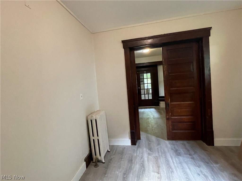 84 Rhodes Avenue, Unit 2 Akron, OH 44302 - Photo 3 of 14 Living Room with Sliding Pocket Doors
