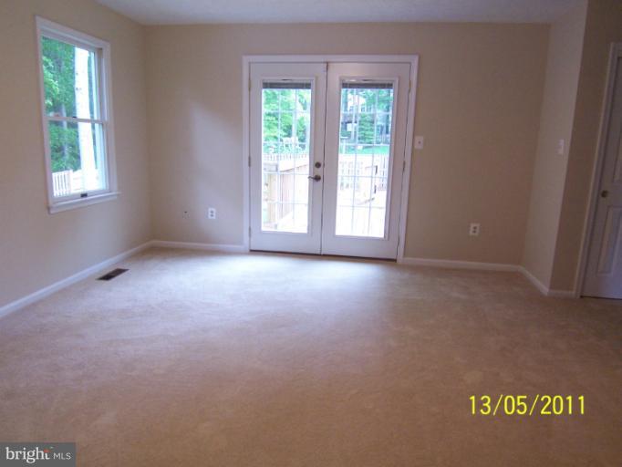 7812 Belleflower Drive Springfield, VA 22152 - Photo 13 of 28 Master Bedroom with French Doors to Deck