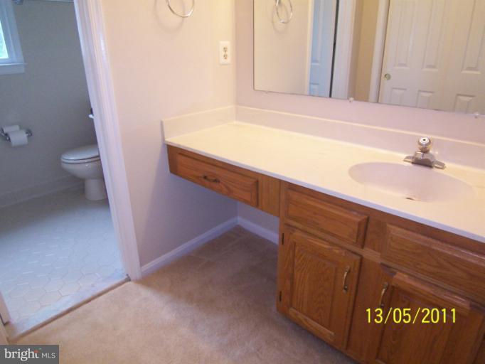 7812 Belleflower Drive Springfield, VA 22152 - Photo 5 of 28 Master Bedroom Full Bath & Dressing area