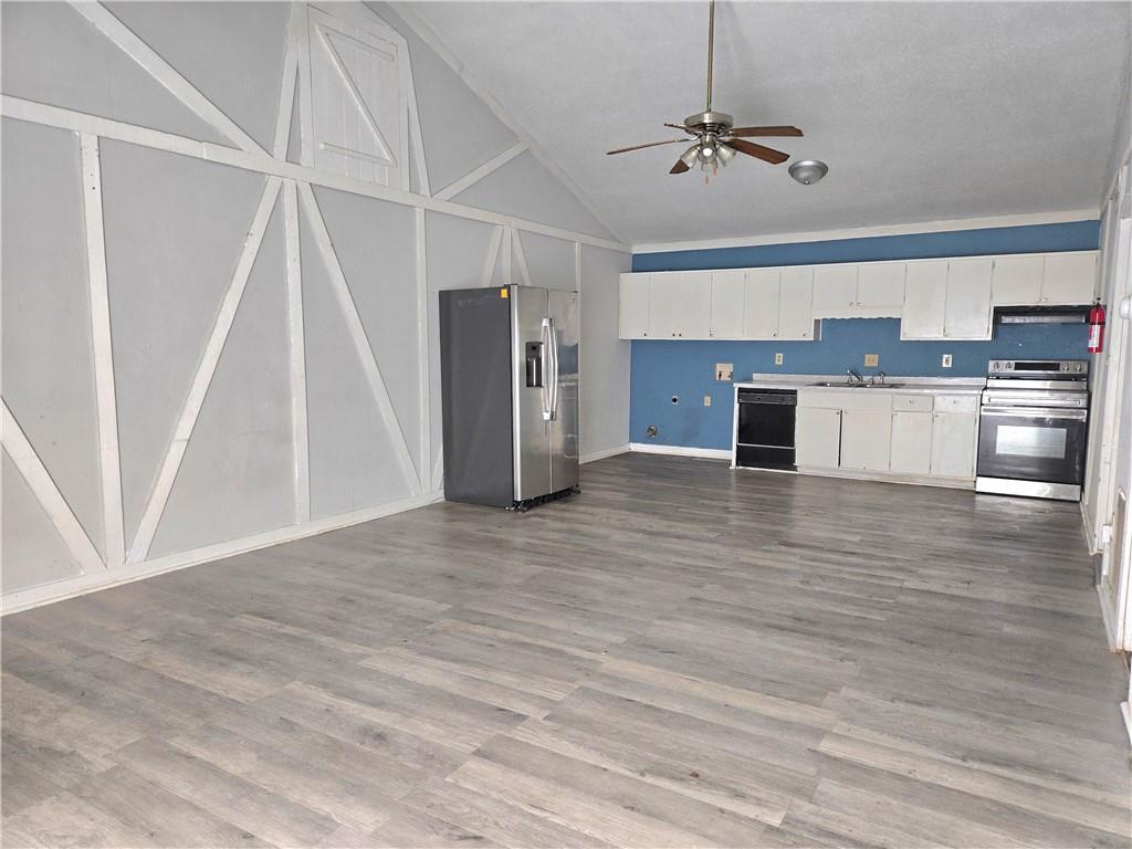 4701 Flat Shoals Road, Unit 67D Union City, GA 30291 - Photo 3 of 13 a view of a kitchen with a sink and a refrigerator