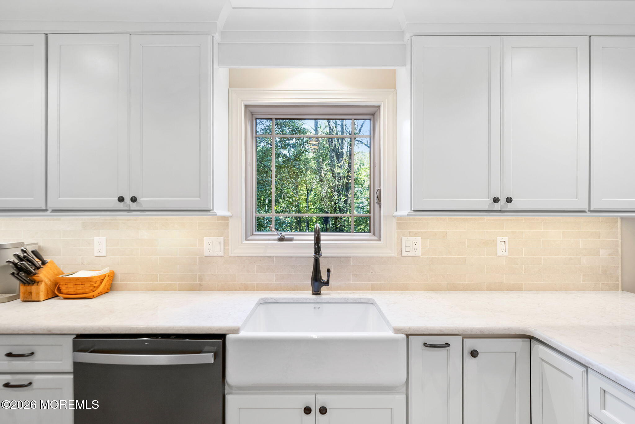21 Stoney Brook Road Holmdel, NJ 07733 - Photo 8 of 40 a kitchen with stainless steel appliances granite countertop white cabinets and window