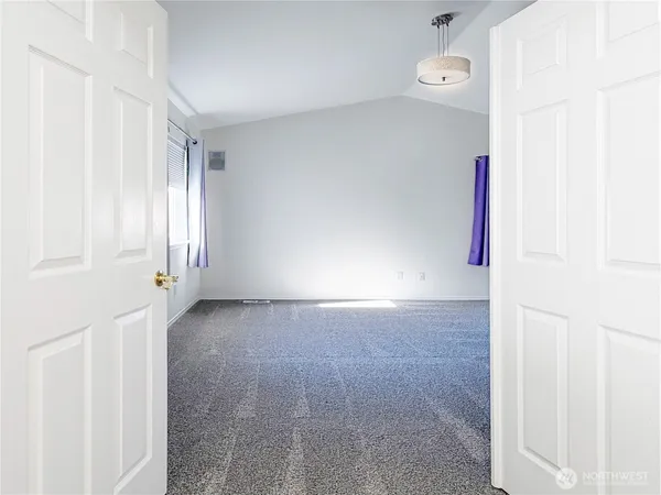 an empty room with a bathroom