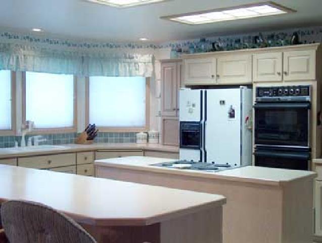 12804 Douglas Road Yakima, WA 98908 - Photo 2 of 9 a kitchen with stainless steel appliances a sink and a stove