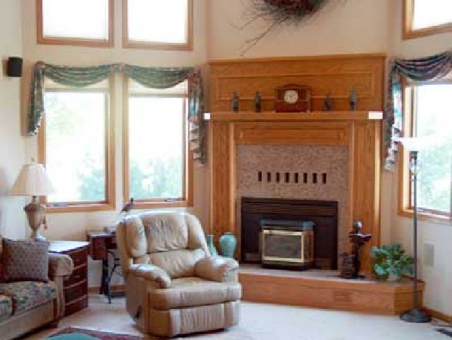 12804 Douglas Road Yakima, WA 98908 - Photo 6 of 9 a living room with furniture and a fireplace