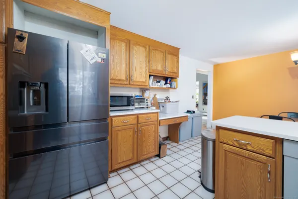 a kitchen with a sink appliances and cabinets