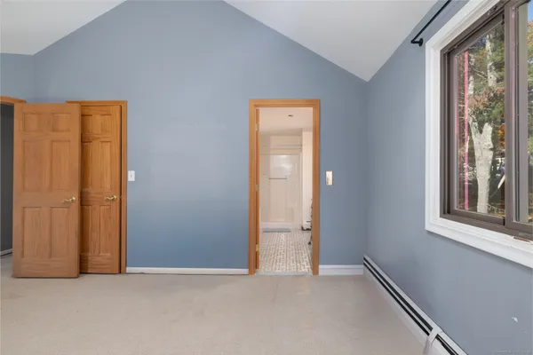 a spacious bathroom with a double vanity sink a mirror and a