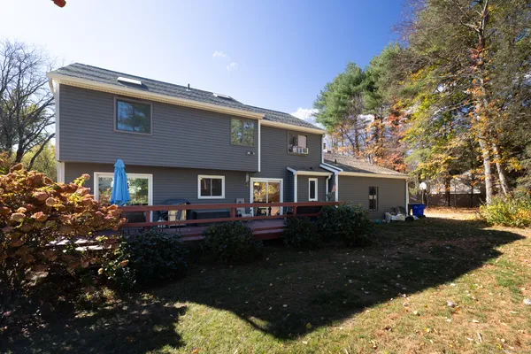 a view of yard with swimming pool and trees