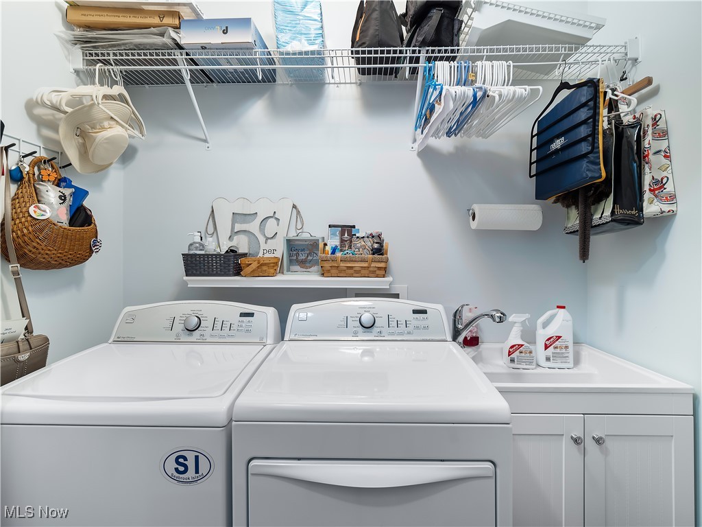 175 Vineyard Road Avon Lake, OH 44012 - Photo 20 of 42 Laundry closet with cabinets and washing machine and clothes dryer