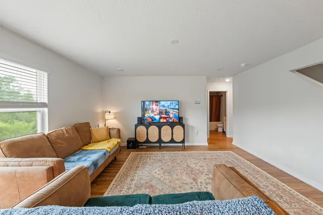 a living room with furniture and a rug