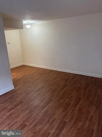 a kitchen with granite countertop a refrigerator stove and microwave