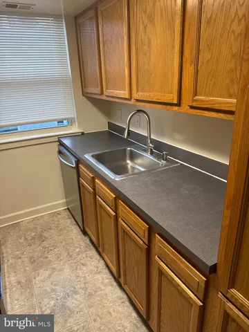 a kitchen with a refrigerator and a stove