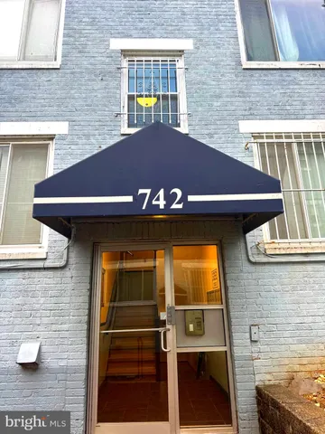 a front view of a house with garage
