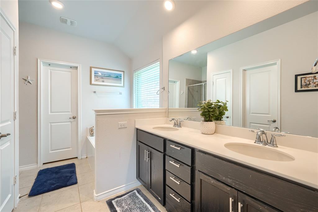 5604 Durst Lane Forney, TX 75126 - Photo 15 of 31 a bathroom with a sink and a mirror