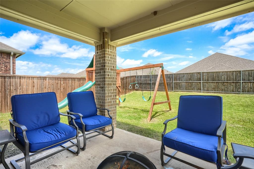 5604 Durst Lane Forney, TX 75126 - Photo 21 of 31 a blue chair sitting in front of a couch