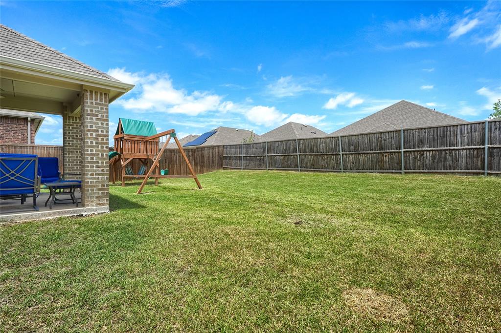 5604 Durst Lane Forney, TX 75126 - Photo 22 of 31 a view of a backyard with a garden and stairs