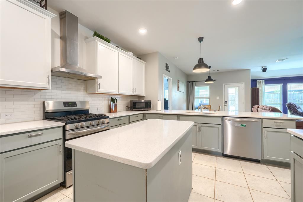 5604 Durst Lane Forney, TX 75126 - Photo 8 of 31 a kitchen with a sink cabinets and window