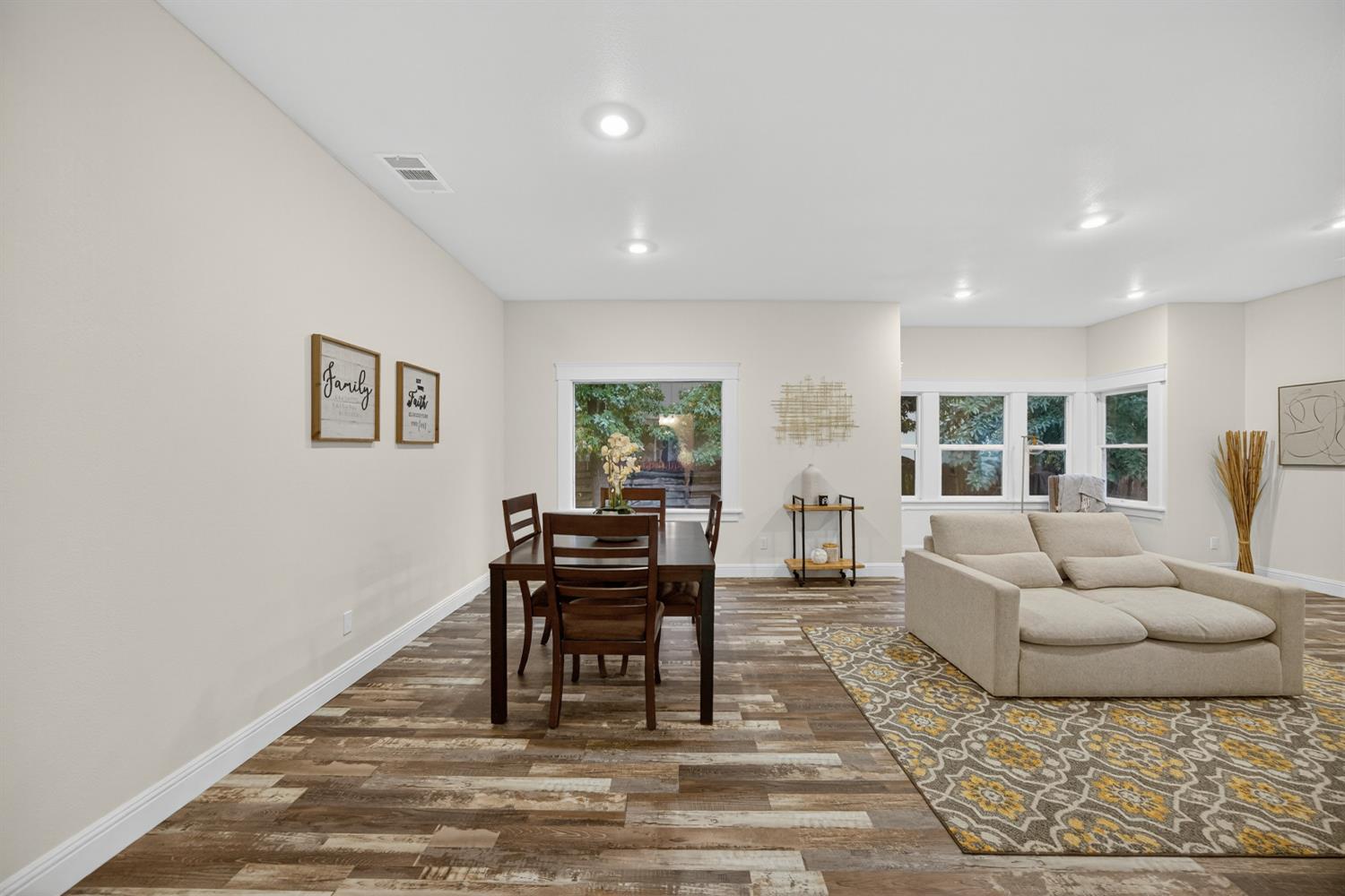 400 Pacific Lodi, CA 95242 - Photo 13 of 50 a living room with furniture and a floor to ceiling window