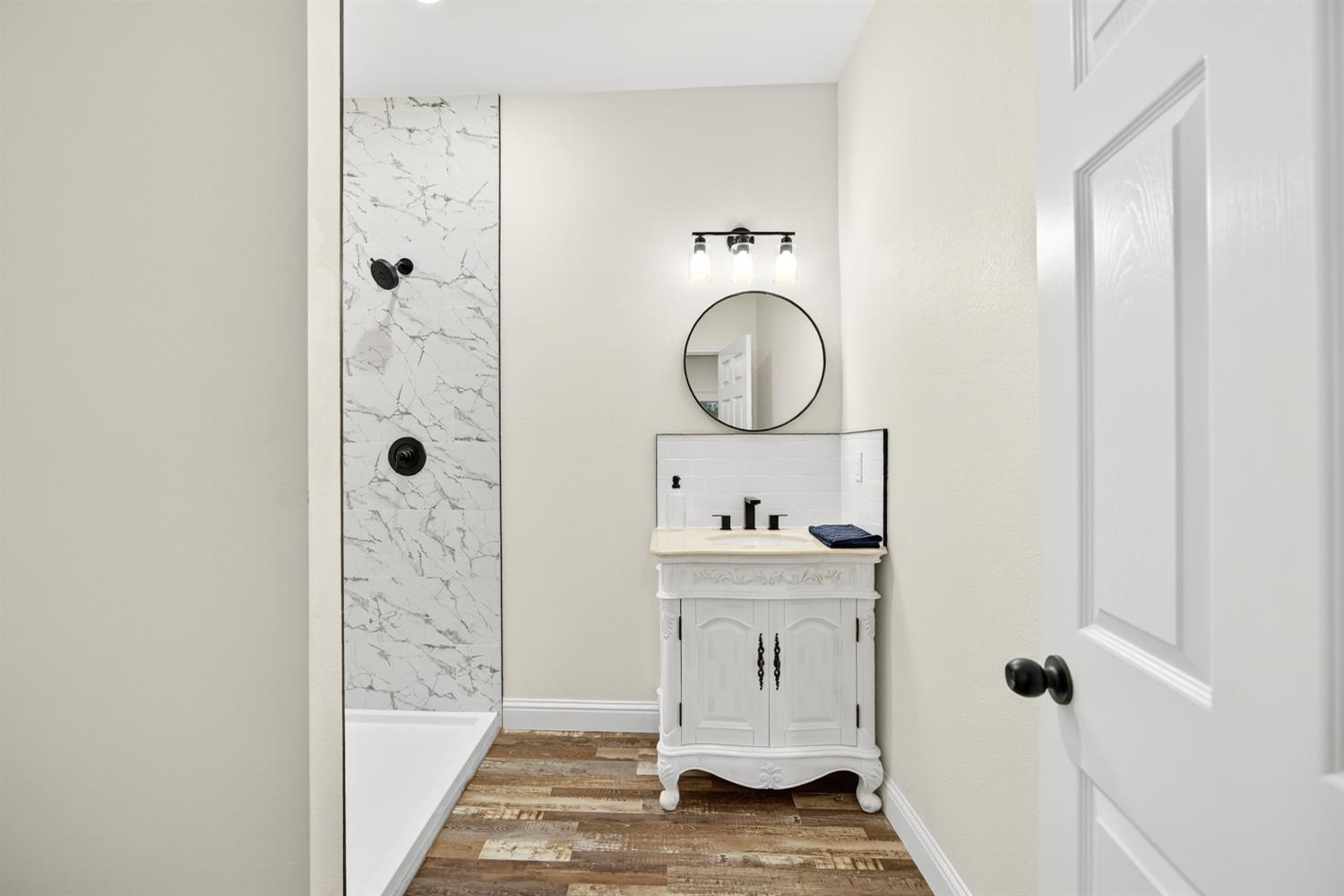 400 Pacific Lodi, CA 95242 - Photo 15 of 50 a bathroom with a sink toilet and shower