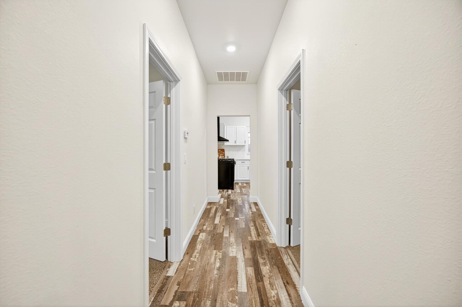 400 Pacific Lodi, CA 95242 - Photo 20 of 50 a view of a hallway with wooden floor and staircase