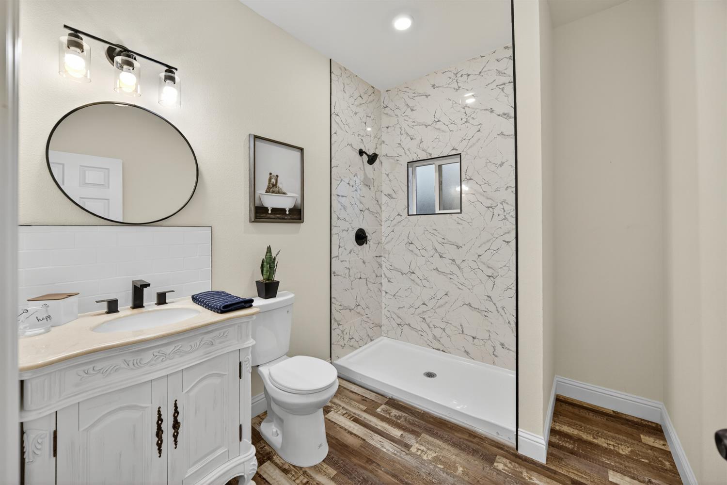 400 Pacific Lodi, CA 95242 - Photo 36 of 50 a bathroom with a toilet sink vanity granite and shower