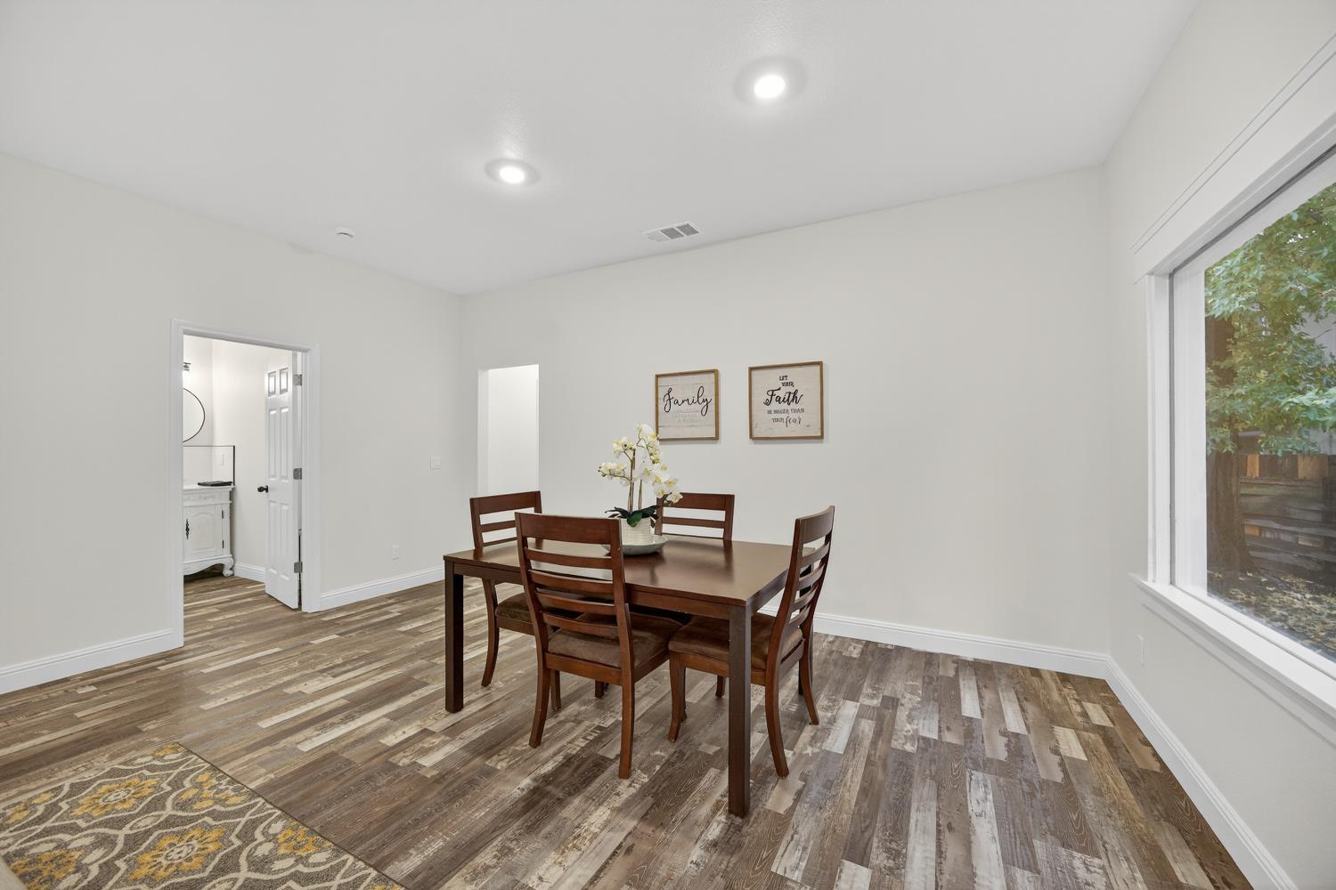 400 Pacific Lodi, CA 95242 - Photo 10 of 50 a view of a dining room with furniture and wooden floor