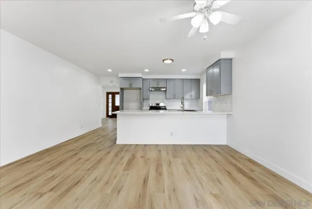 a view of kitchen with wooden floor and window