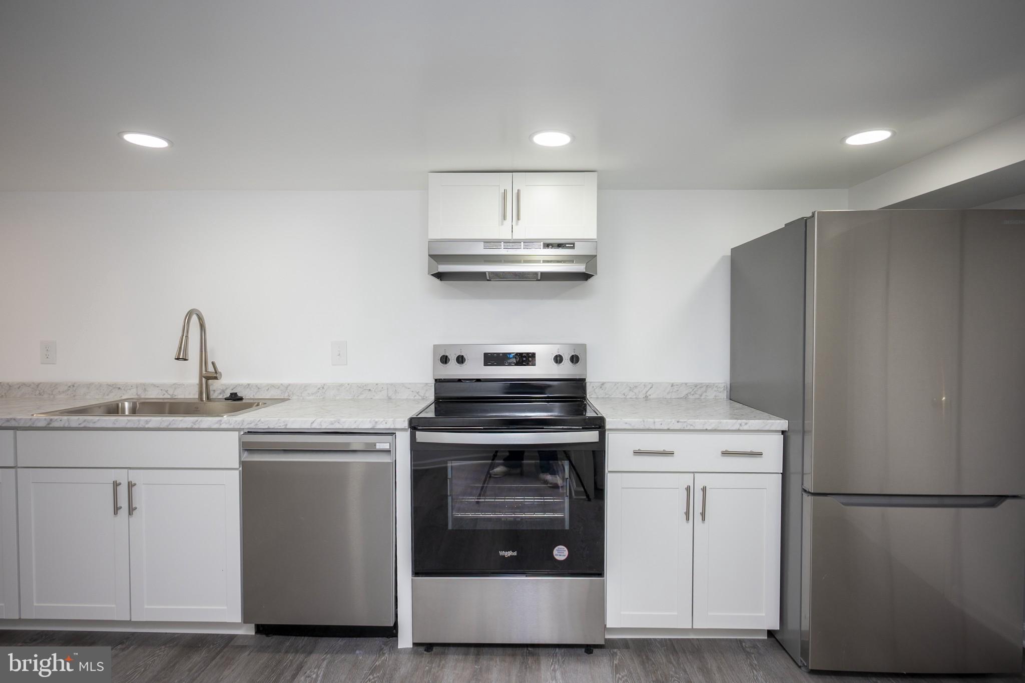 2104 Steuben Way Silver Spring, MD 20905 - Photo 19 of 25 a kitchen with stainless steel appliances granite countertop a sink stove and refrigerator