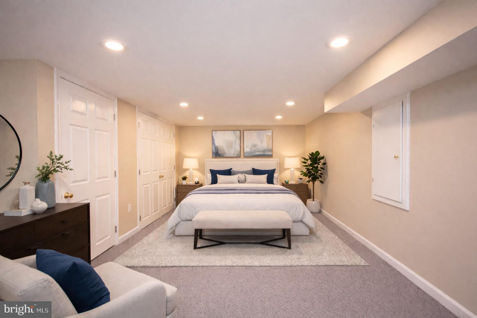 2104 Steuben Way Silver Spring, MD 20905 - Photo 3 of 25 a spacious bedroom with a bed and a chandelier