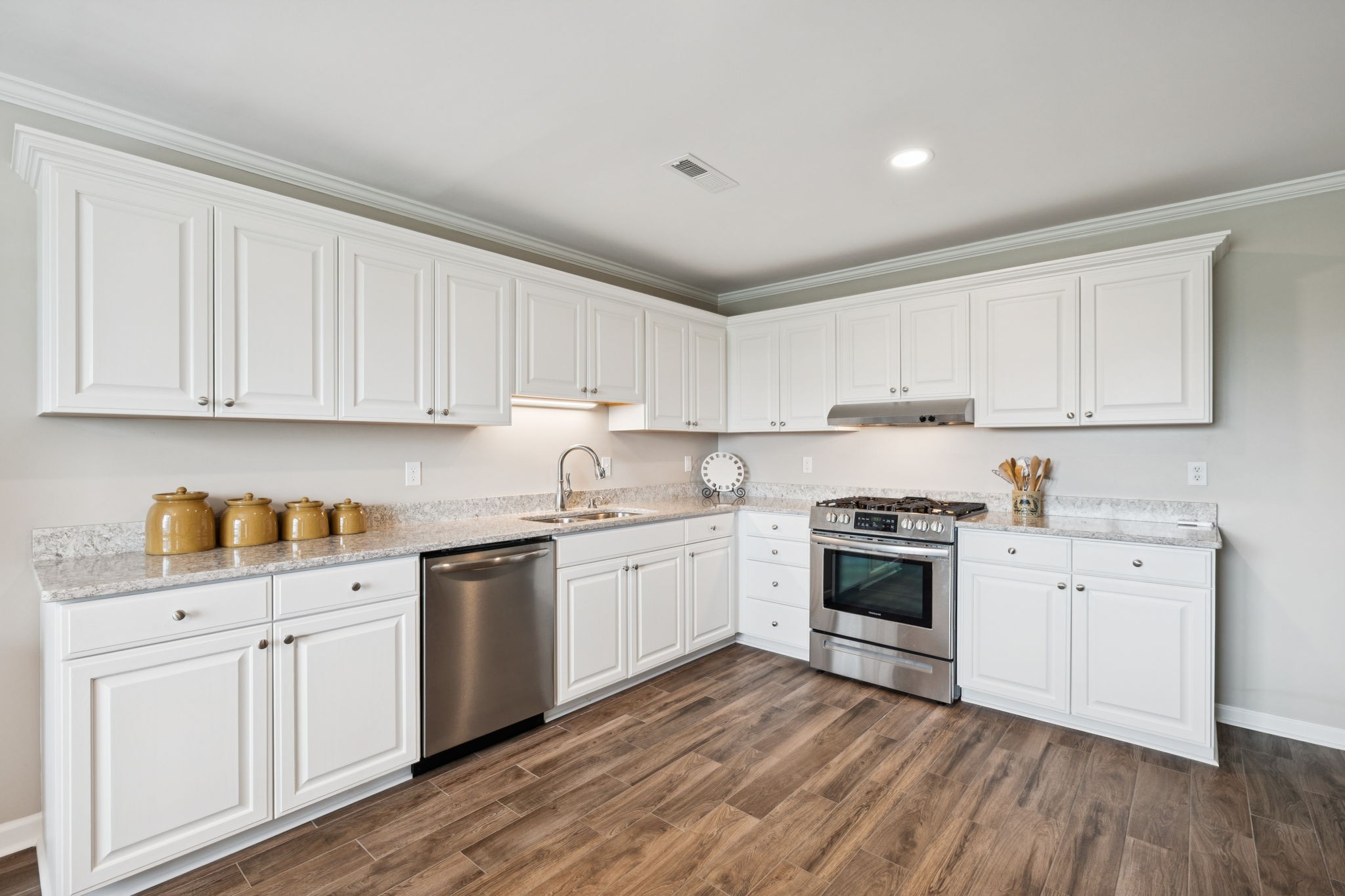1731 Hudson Road Madison, TN 37115 - Photo 48 of 75 a kitchen with granite countertop white cabinets and white appliances