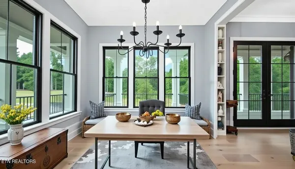 a view of a dining room with furniture window and outside view