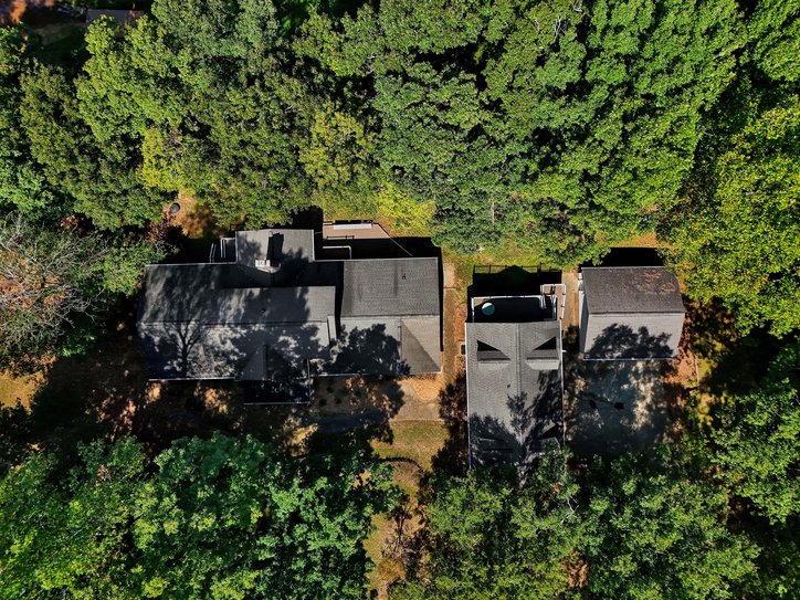 106 Pikes Ridge Anderson, SC 29626 - Photo 15 of 41 Lush mature trees envelope this secluded property featuring multiple structures and a rear deck.