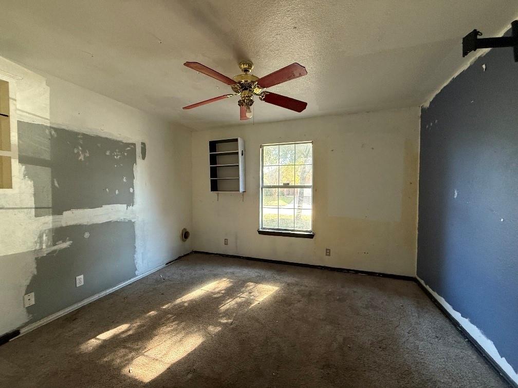 5424 Appalachian Way Fort Worth, TX 76123 - Photo 15 of 16 an empty room with windows and fan