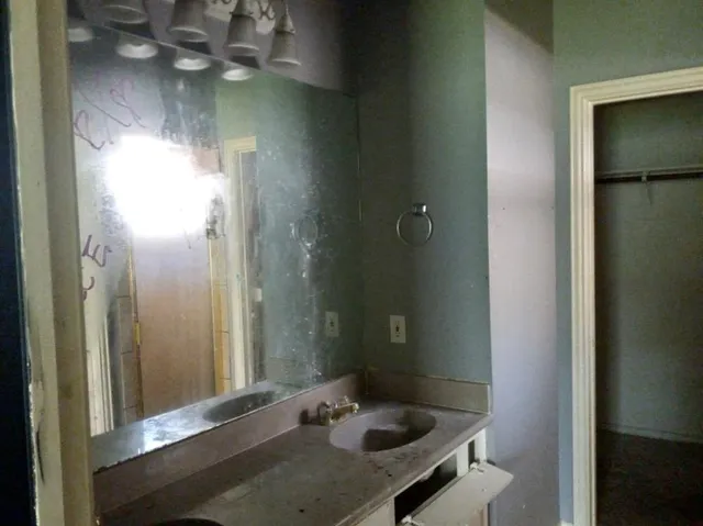 a bathroom with a sink and a mirror