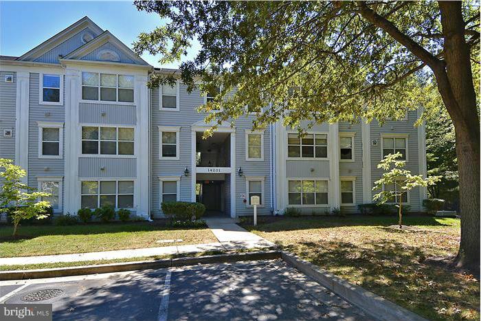 14201 Woolen Oak Court, Unit 432 Silver Spring, MD 20906 - Photo 1 of 20 a front view of a house with a yard