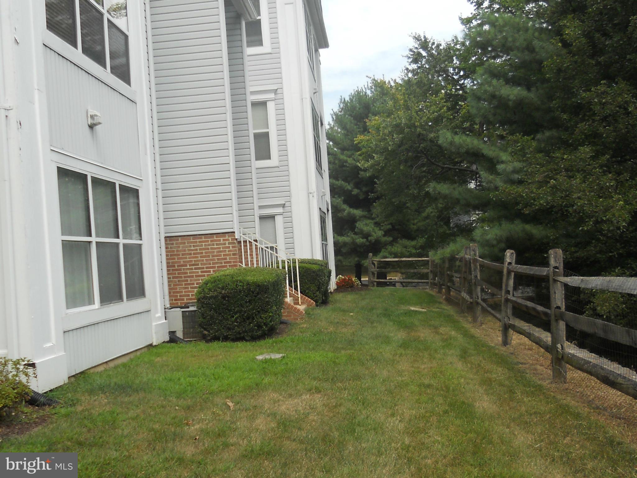 14201 Woolen Oak Court, Unit 432 Silver Spring, MD 20906 - Photo 16 of 20 a view of backyard with green space