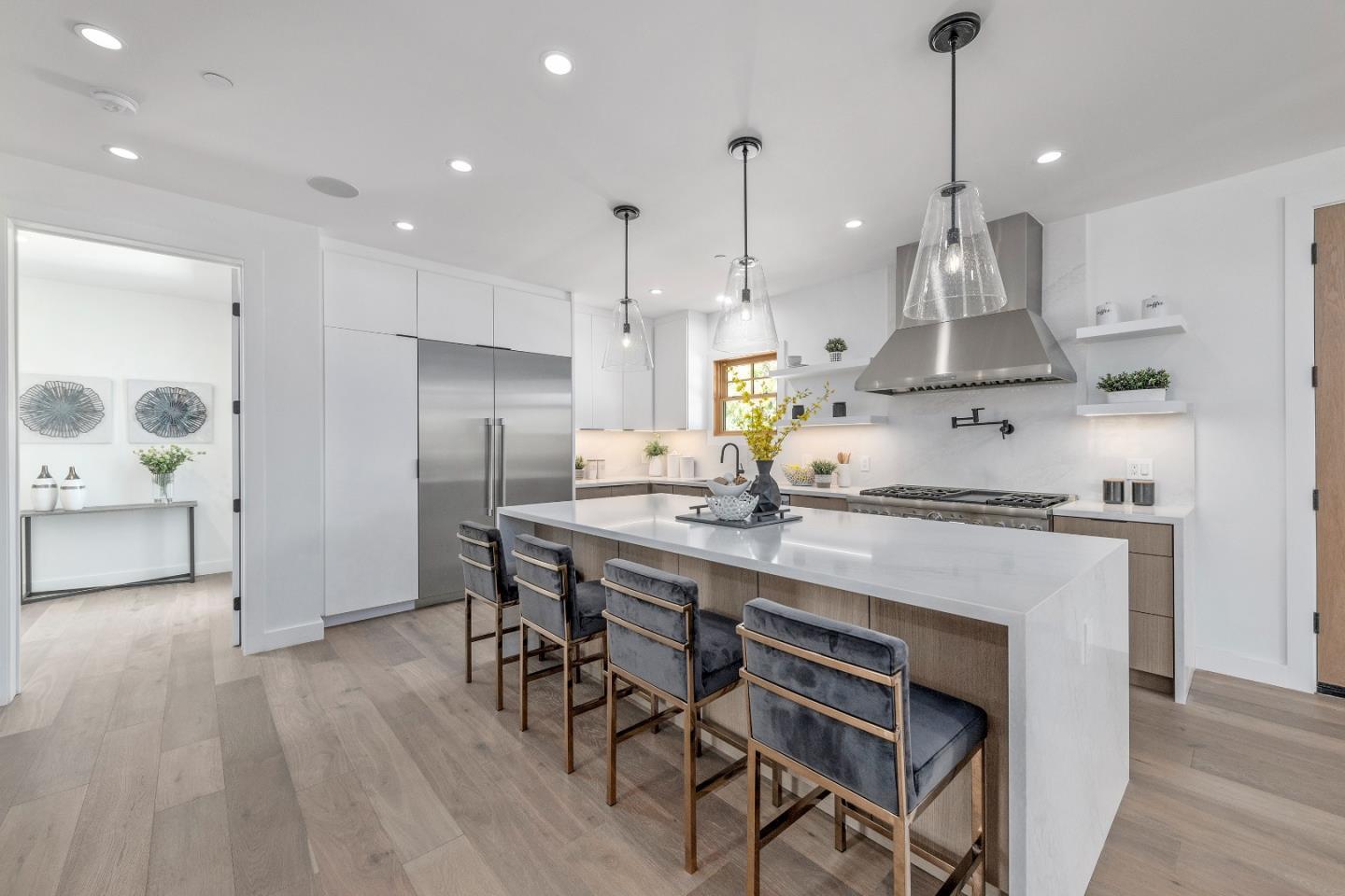 1151 Rosedale Avenue Burlingame, CA 94010 - Photo 13 of 38 a kitchen with stainless steel appliances kitchen island a refrigerator and a wooden floor