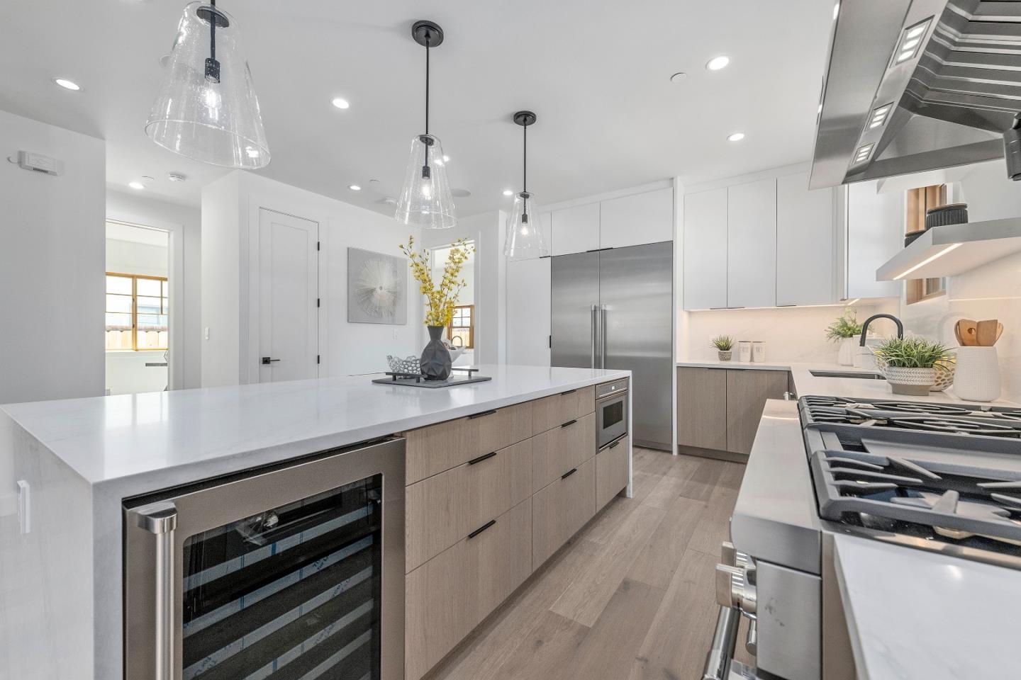 1151 Rosedale Avenue Burlingame, CA 94010 - Photo 15 of 38 a kitchen with kitchen island a stove a sink and a refrigerator