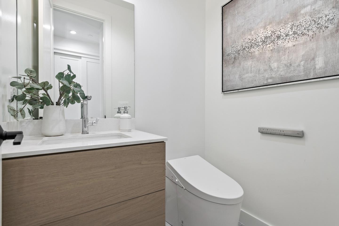 1151 Rosedale Avenue Burlingame, CA 94010 - Photo 19 of 38 a bathroom with a toilet sink and mirror