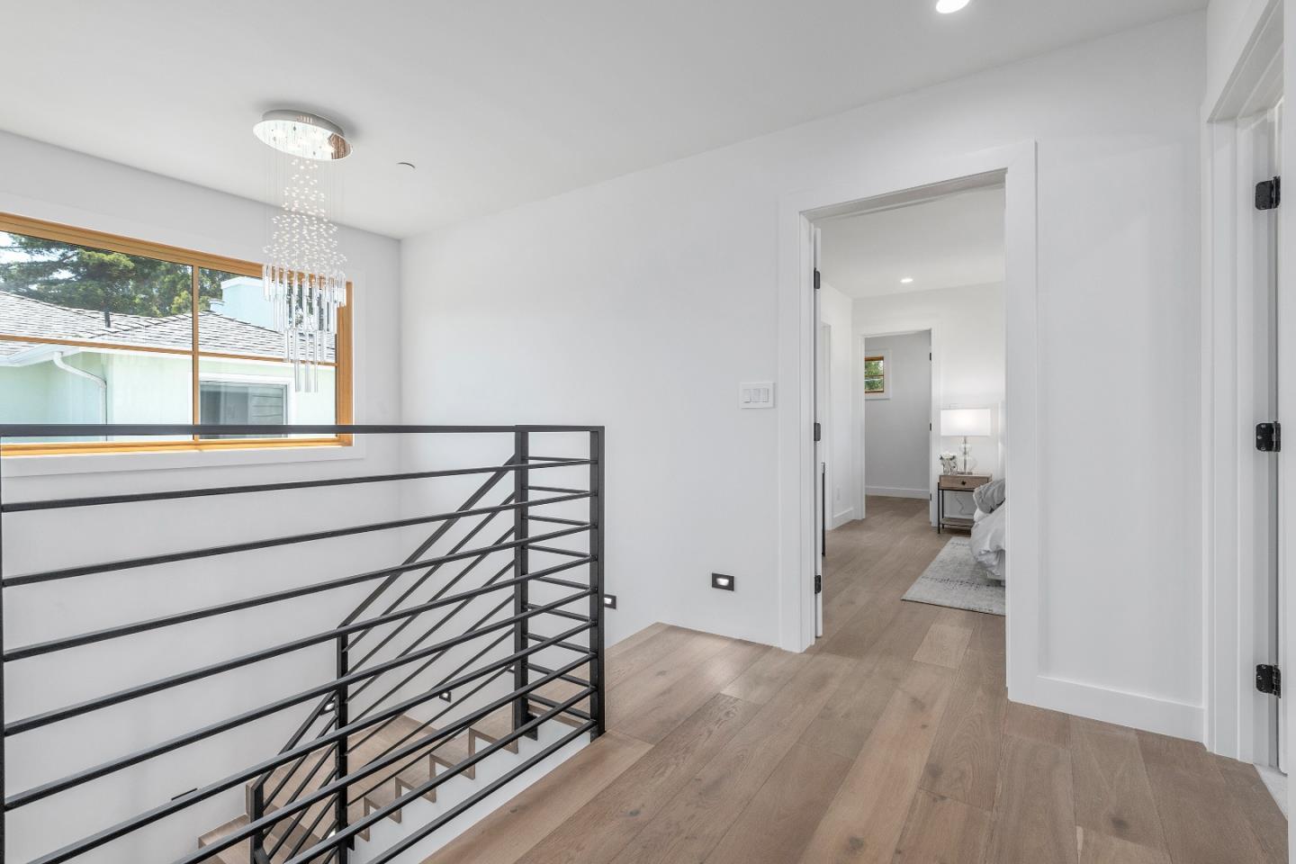 1151 Rosedale Avenue Burlingame, CA 94010 - Photo 23 of 38 a view of a hallway with wooden floor and windows