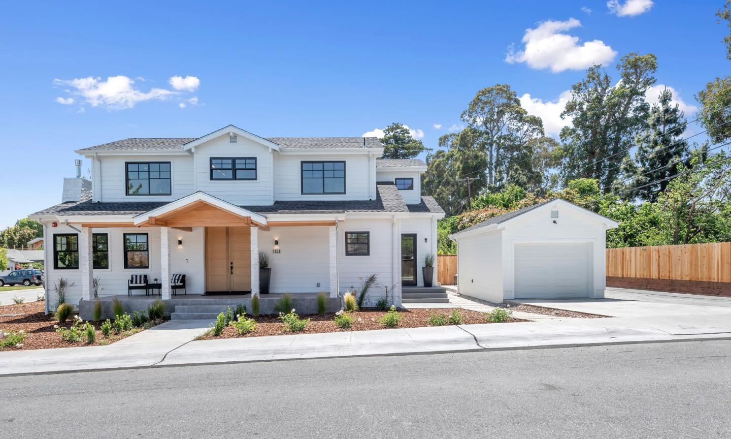 1151 Rosedale Avenue Burlingame, CA 94010 - Photo 3 of 38 a front view of a house with a yard and garage