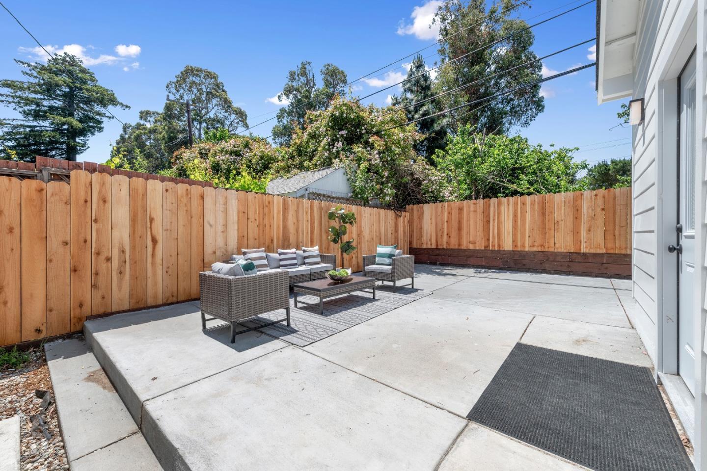 1151 Rosedale Avenue Burlingame, CA 94010 - Photo 35 of 38 a view of a patio with table and chairs with wooden fence