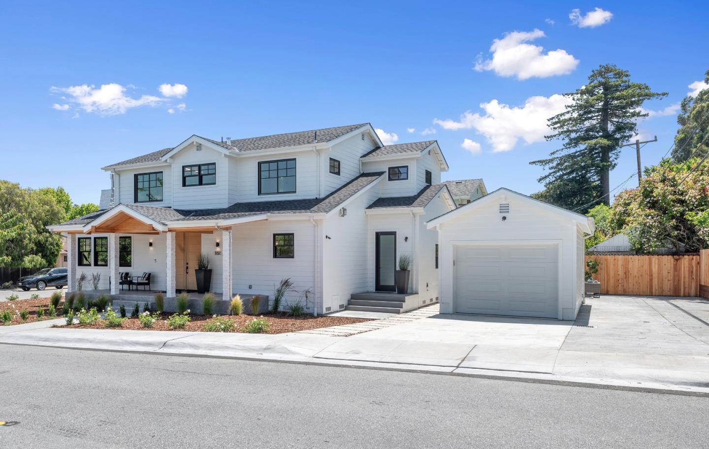 1151 Rosedale Avenue Burlingame, CA 94010 - Photo 4 of 38 a front view of a house with a yard and garage