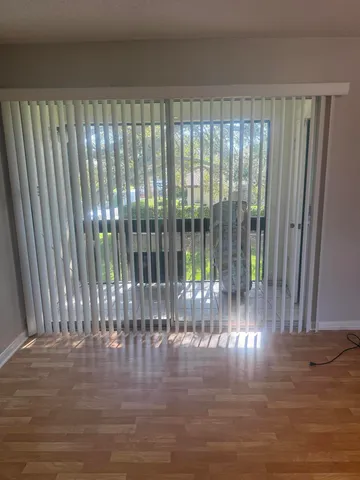 a view of a porch with wooden floor
