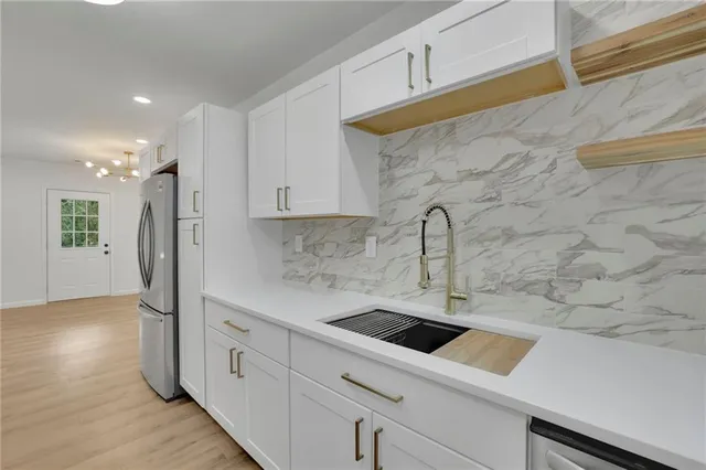 a kitchen with a sink and cabinets