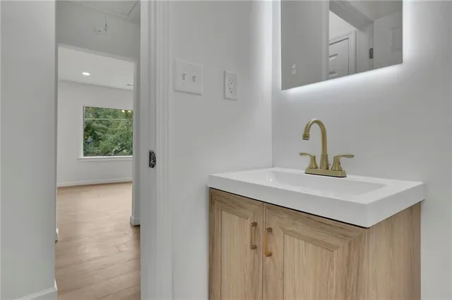 a bathroom with a sink and mirror