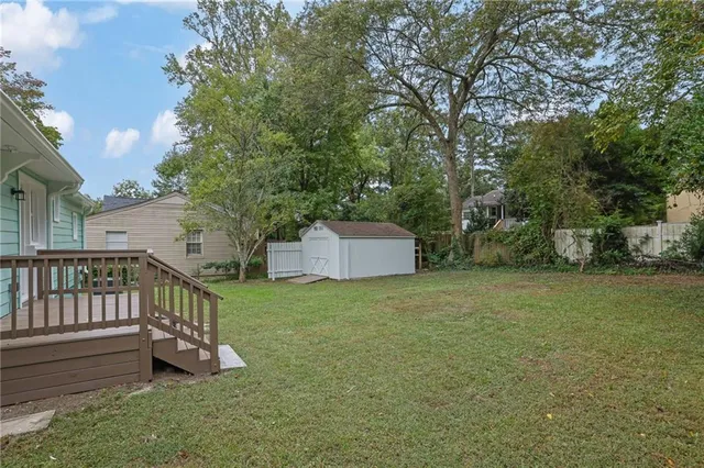 a view of a deck with a yard